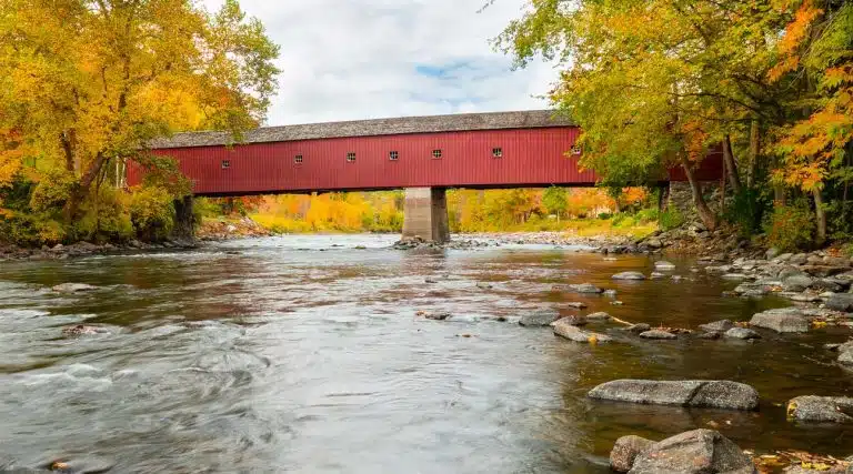red covered bridge during Autumn in Hamden, Connecticut