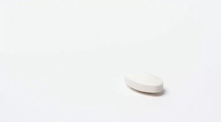 white oval shaped pill resembling an Ambien sleeping pill