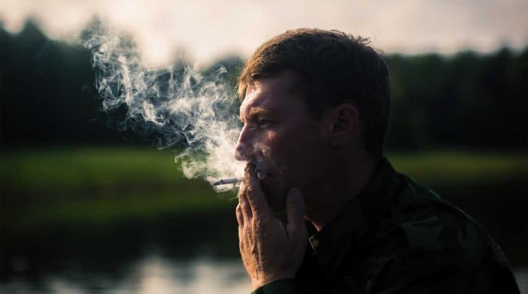 man smoking oxycodone
