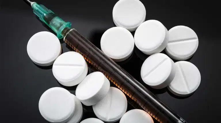 Methadone pills and syringe injecting and snorting Methadone