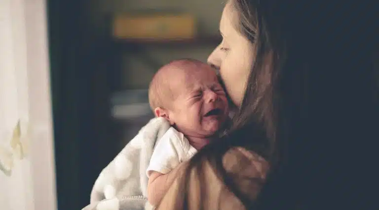 Meth baby mother holding her newborn baby