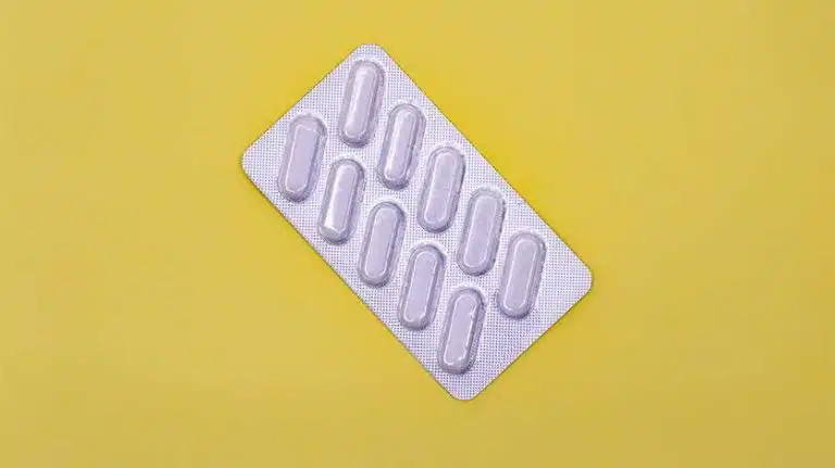 blister pack of white pills - BuSpar Drug Class & Schedule