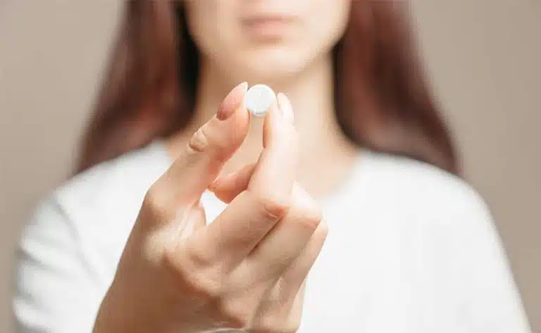 woman holding trazodone-Is Trazodone A Controlled Substance?