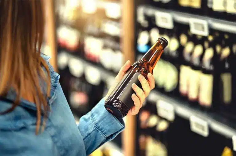 Woman Looking At Non-Alcoholic Beer-Is Non-Alcoholic Beer A Healthy Beer Alternative?