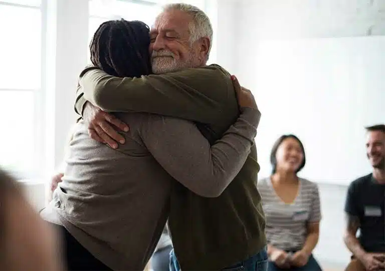 A Man & A Woman Hugging In Recovery-20 Random Acts Of Kindness For Addiction Recovery