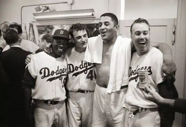 Don Bessent and Dodgers teammates celebrating a win in their locker room 