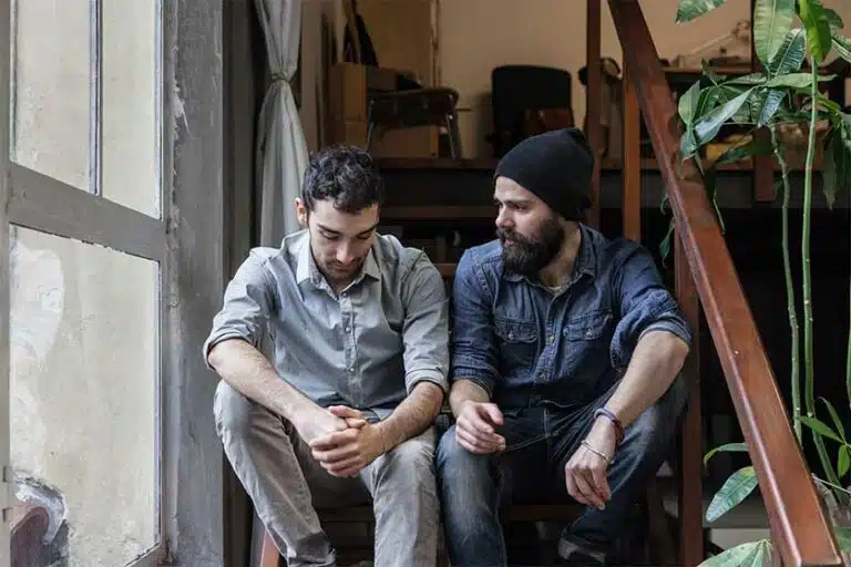 Brothers Having A Serious Conversation-Getting Your Brother Into Drug Rehab | Do's & Don'ts