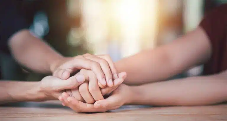 Spouses Holding Hands-Getting Your Spouse Into Drug Rehab | Do's & Don'ts